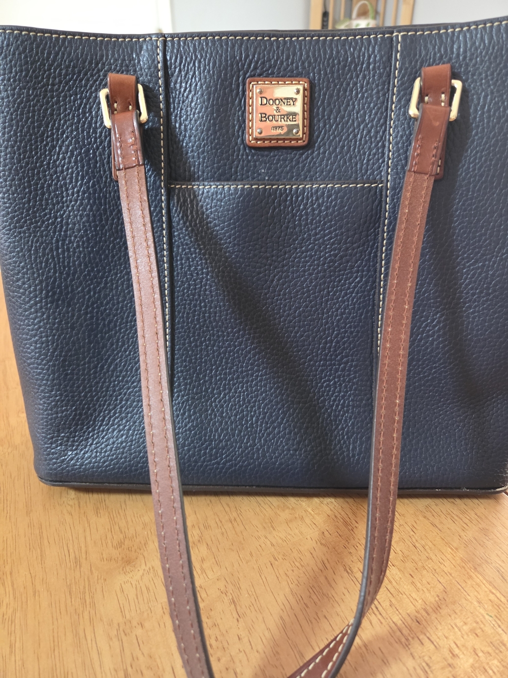 Dooney & Bourke Navy Pebbled Leather Tote with Brown Straps and Gold Logo